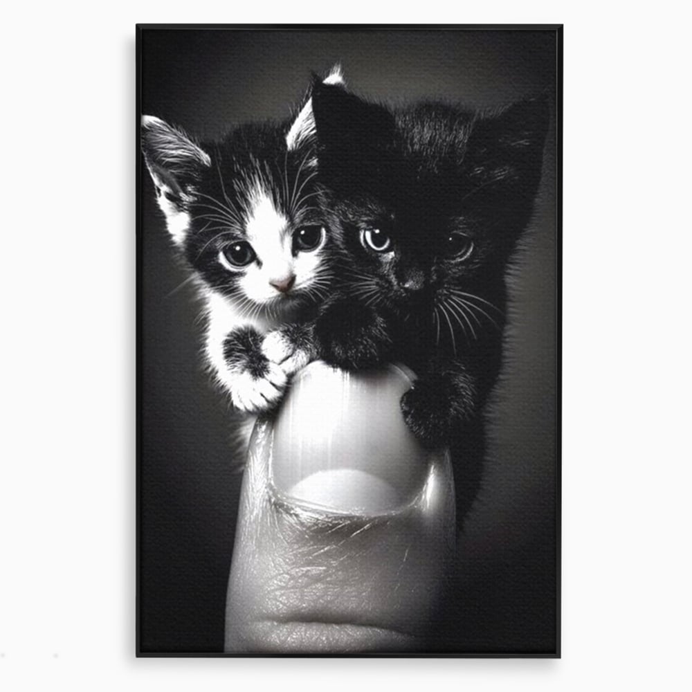 Tablou canvas cu tablou canvas cu doi pisoi mici agatati de un deget, in rama de aluminiu negru